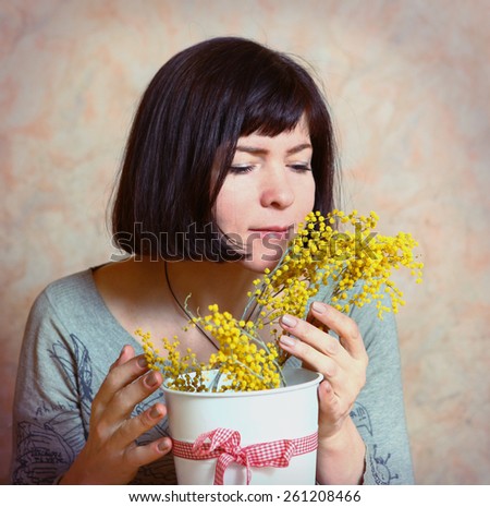 happy mother with mimosa flowers presented on womans day