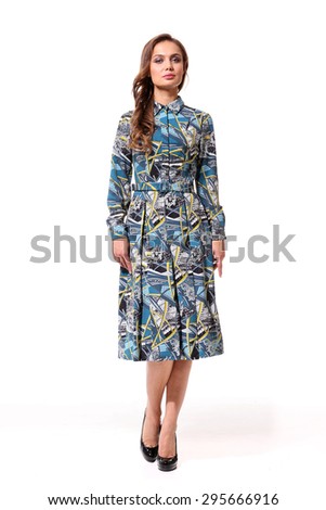 beautiful model with brown long hair show printed blue  dress for catalog isolated on white