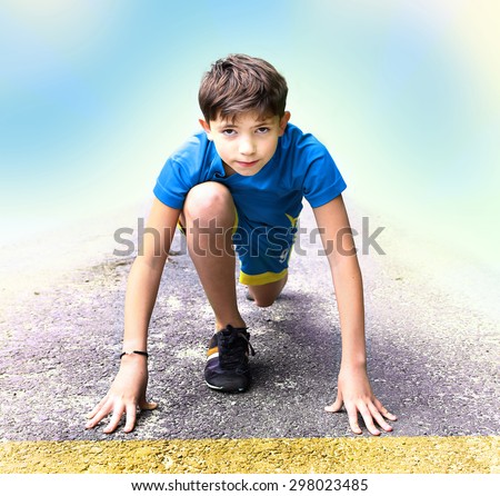 preteen handsome boy in sport clothes and shoes prepare to have running event contest