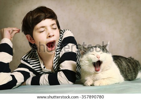 Similar – Image, Stock Photo Tired boy and cat sleeping on bed