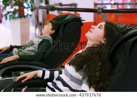 Teen Siblings Brother And Sister In Massage Chair In Shopping Mall 437937676 Teen Siblings Brother And Sister In Massage Chair In Shopping Mall 437937676