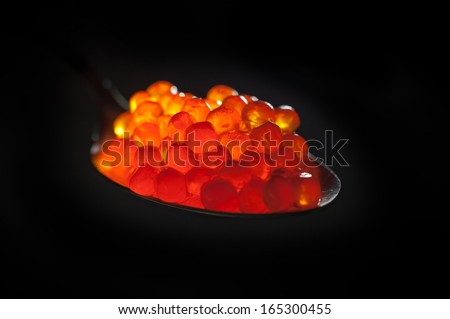 Red caviar on Black Background