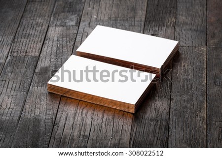 thick white cotton paper business card mock up with brassy foil on the edges