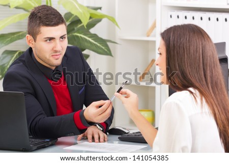 young business man giving a pen to sign the contract to the client