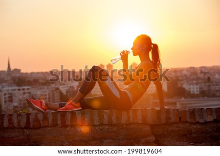 Similar – Image, Stock Photo Beautiful fit girl exercising at home for coronavirus. Brunette European girl working out her abs.