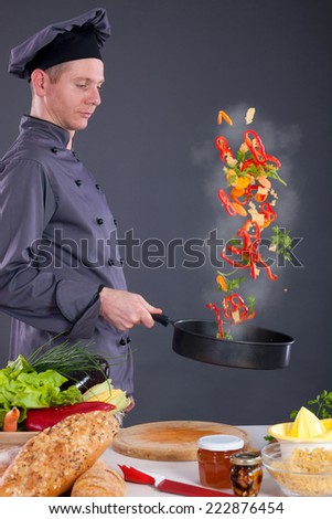 professional chef throws food in the pan