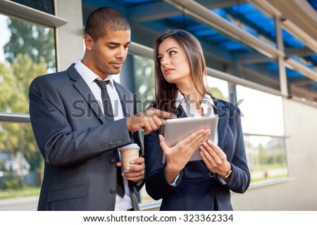 Business people on coffee break using digital tablet