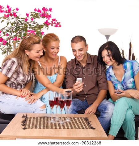 Three Beautiful Women and man Friends Using Smart Phone