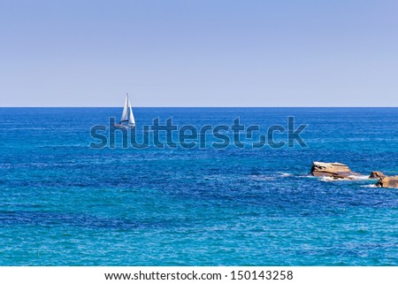 Sailboat sailing on the ocean horizon line