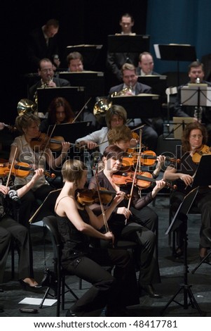 BUDAPEST - MARCH 06: Members of the MAV  Symphonic Orchestra perform on stage at Thalia Theater on March 06, 2010 in Budapest, Hungary.