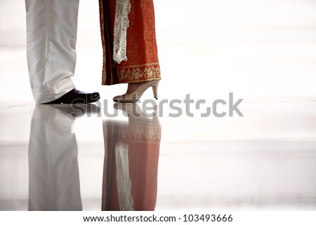 Couple legs shot in thai wedding dress and suite