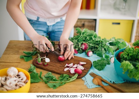 Healthy food. Woman preparing mushrooms and vegetables