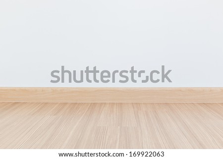 Empty room with wall and wooden floor laminate