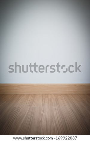 Empty room with wall and wooden floor laminate