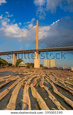View landscape Rope bridge and  Pile of wood be immersed in water at the Bangkok Asia Thailand