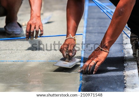 plasterer concrete worker smooth the cement