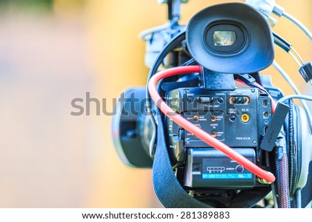 Video camera operator working with his professional equipment