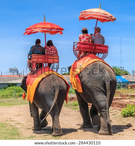 Tourists on an elephant ride tour of the ancient city Ayutthaya Asia Thailand