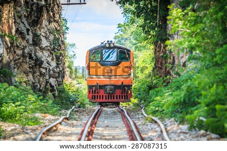 Train tours and train running  past tunnel  kanjanaburi,Thailand