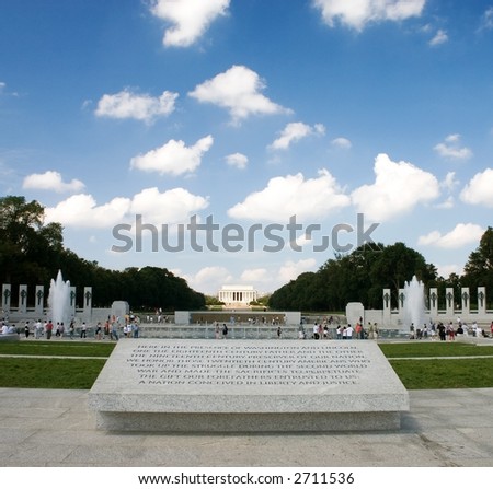 World War two memorial inscription with lincoln monument in background