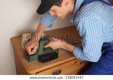 Carpenter renovating old furniture