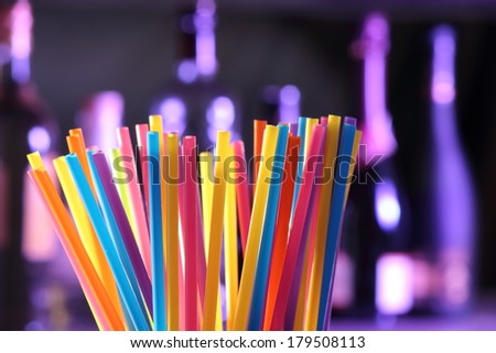 A Straw in a Soda or Cocktail on a bar