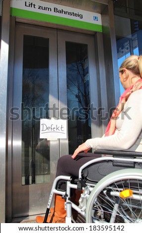 Wheelchair user on a defect elevator