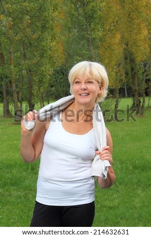 A Older woman with towel doing sports