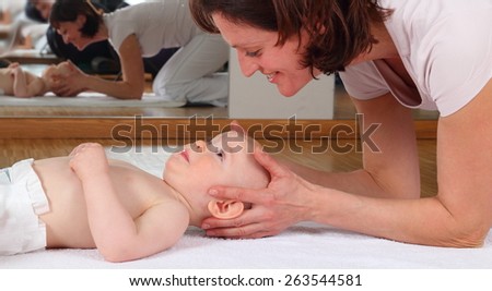 A Osteopathy with baby with blockade on cervical vertebrae