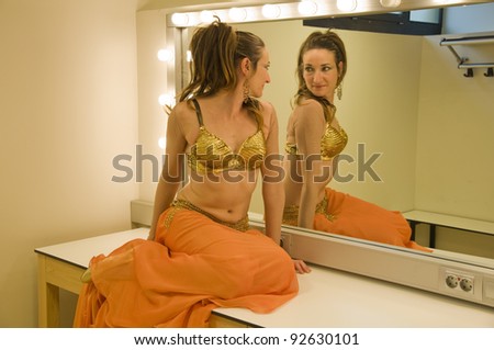 Ballerina looking in mirror