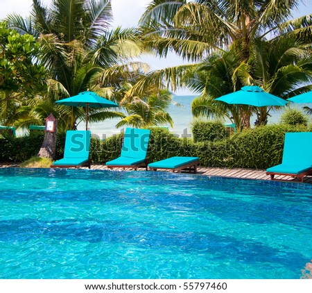 Cozy chairs near luxury pool