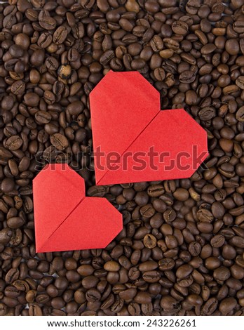 Valentine's day, wedding, love, Red, pink heart, paper heart .Red paper heart on background of coffee beans. Textures of roasted coffee bean with red heart for background.