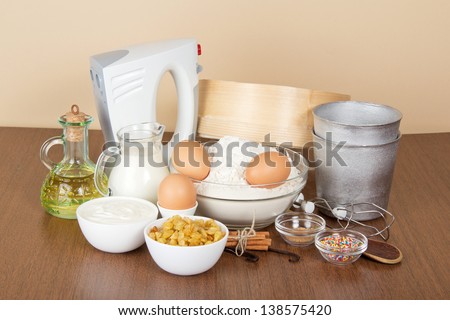 Products and baking dishes of Easter, means for ornament, on the beige