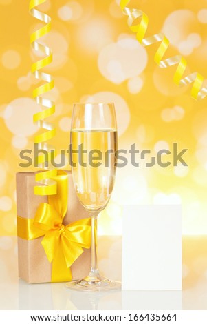 Flutes of champagne, gift box and empty card