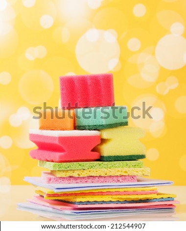 Sponges for washing dishes on yellow background