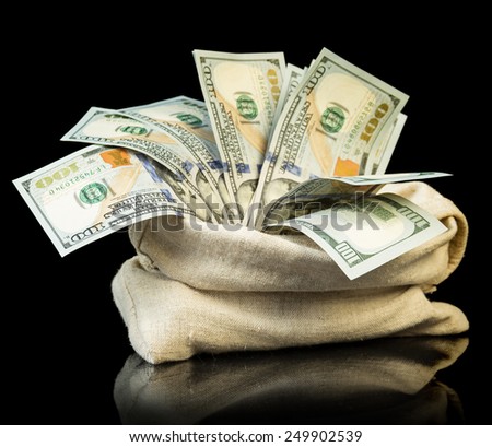 The dollar Money bills in bag on black background