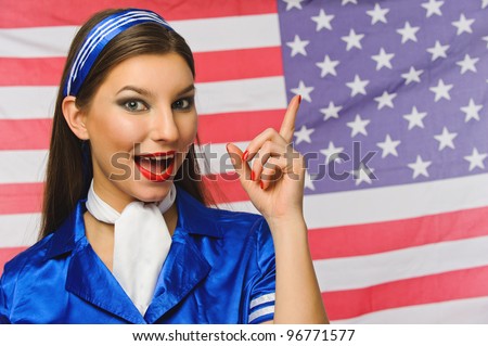beautiful girl dressed as flight attendants on an American flag background