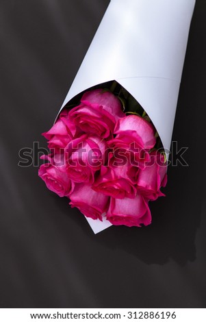 Bouquet of roses on a black background. Greeting template background for greeting card, gift, present