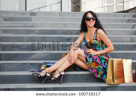 Young female shopper on the steps
