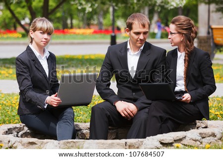 Young business people with laptop
