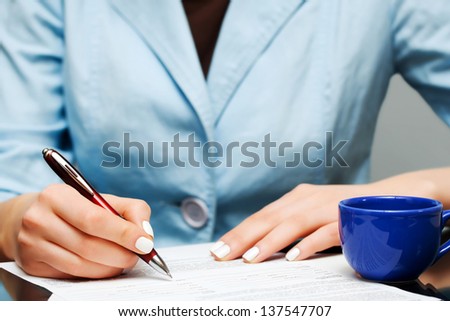 Business woman signing contract