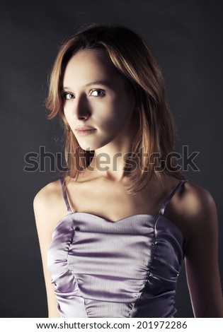 Young fashion woman in a lilac dress