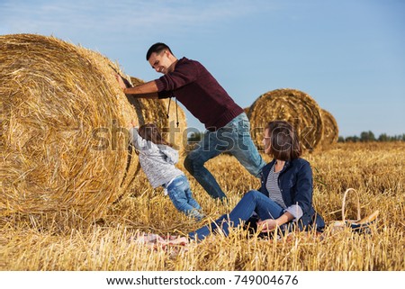 Similar – Image, Stock Photo Woman Pushing Hay Bale