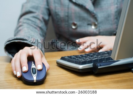 Female hands working on the computer.