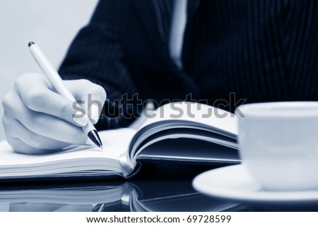 Businesswoman writing