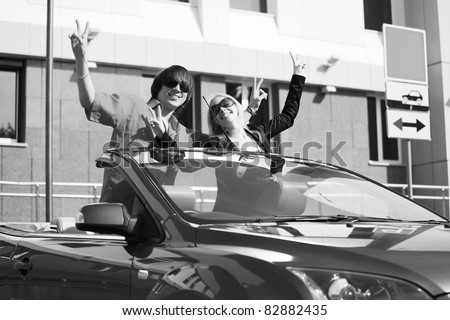 Happy young couple in the car