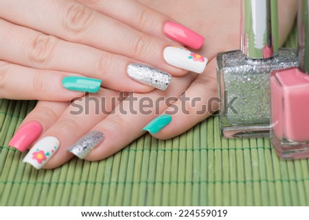 Manicure - Beauty treatment photo of nice feminine manicured woman fingernails. Selective focus.