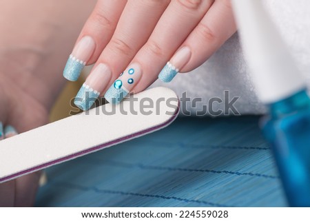 Manicure - Beauty treatment photo of nice manicured woman fingernails. Selective focus.