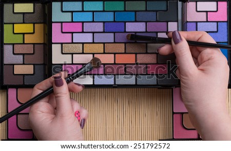 Palette of professional colorful eye shadows. Cosmetology product.
