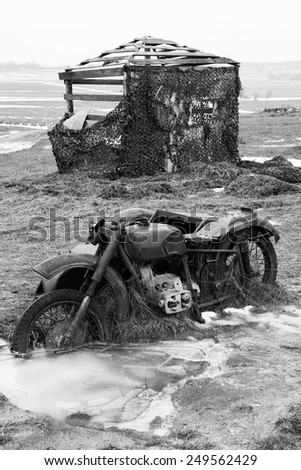 Old broken german motorcycle. WWII. Black and white